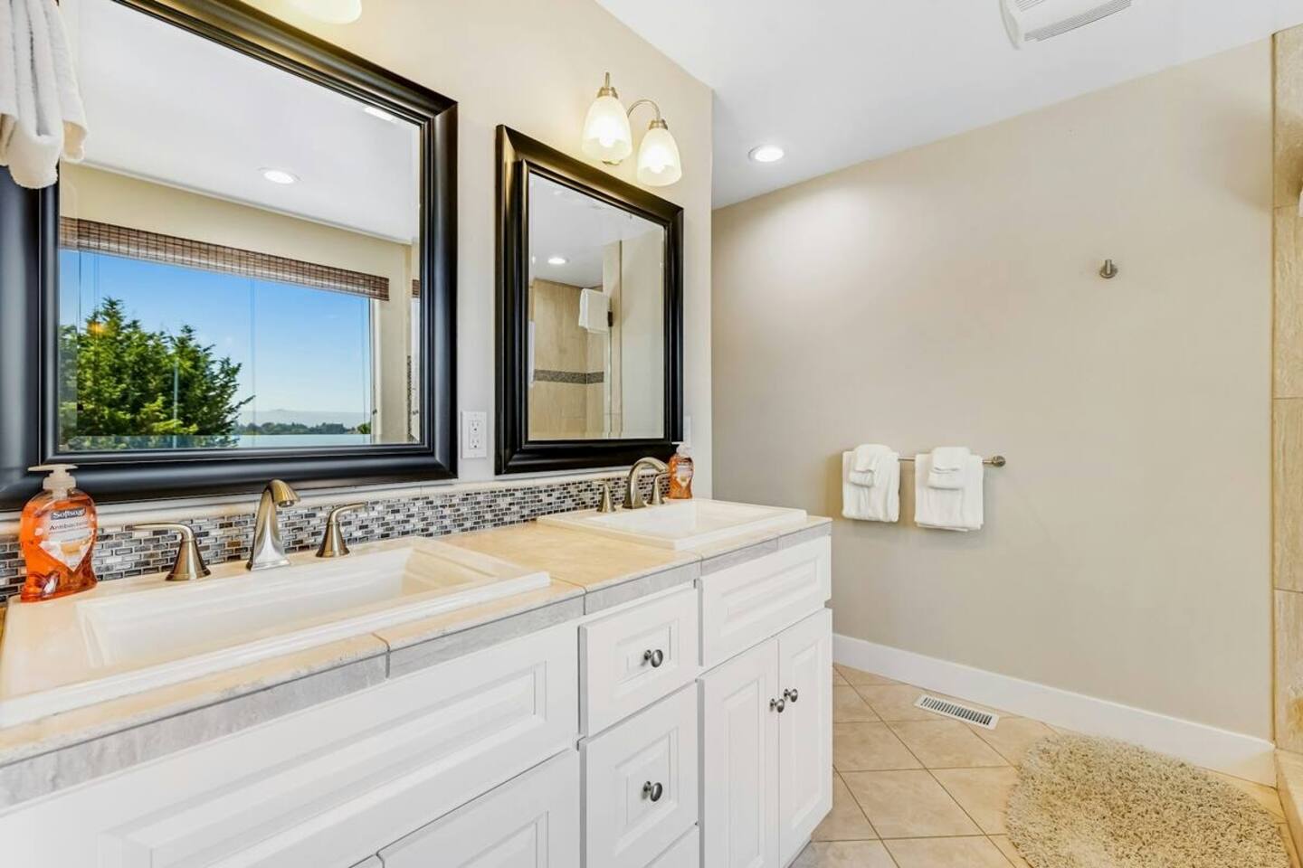 Double the convenience with a spacious twin vanity for easy morning routines.