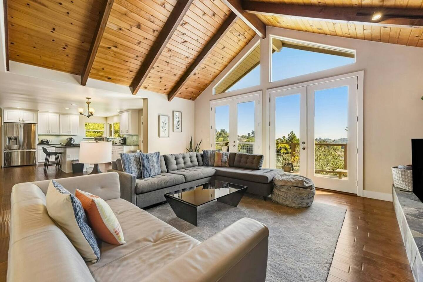 Bright, open, and perfect for gathering—enjoy views of the orchard, a cozy fireplace, and movie nights on the smart TV.