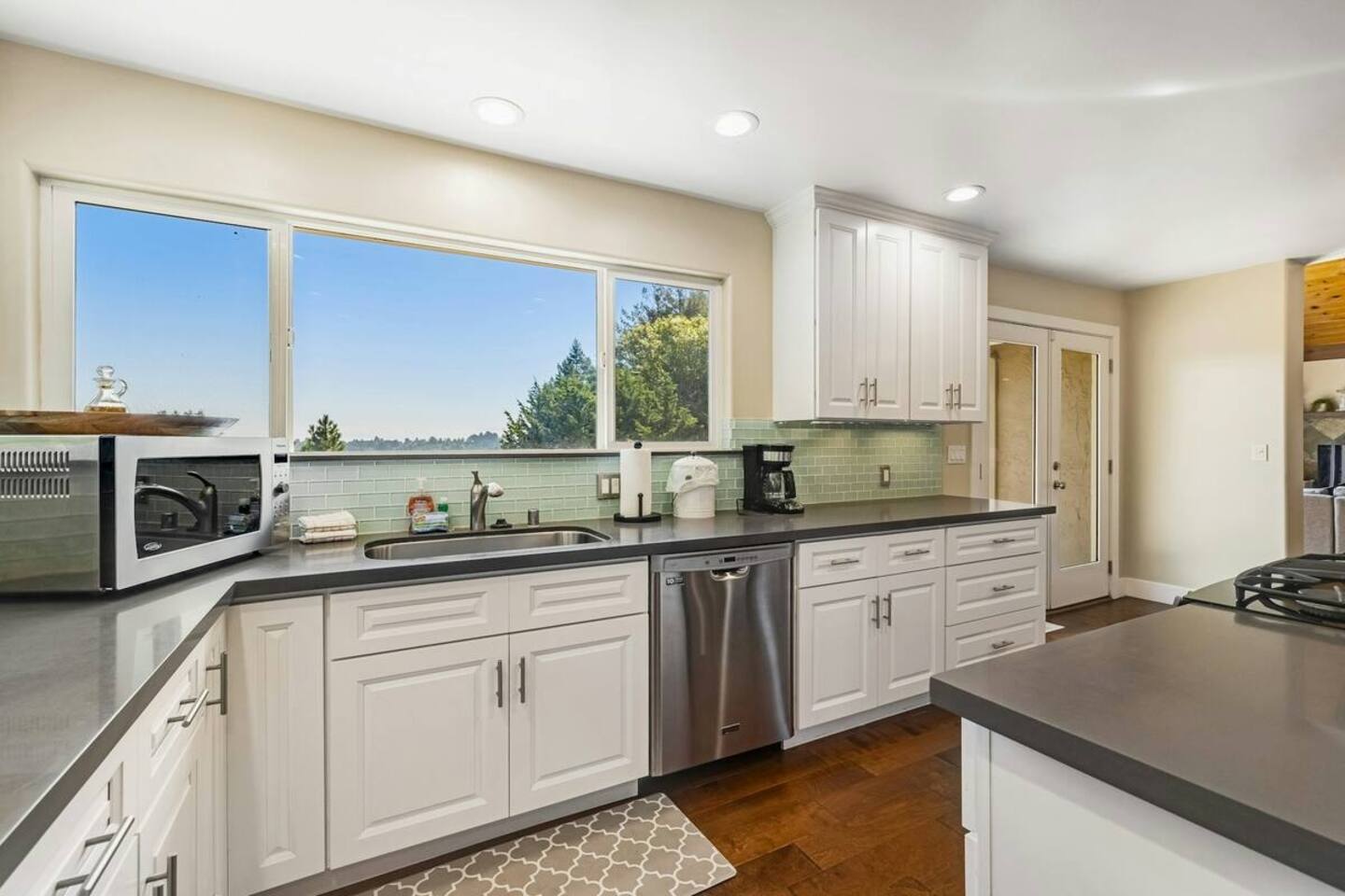 Cook with a view—sunlight pours in as you prep and gather.