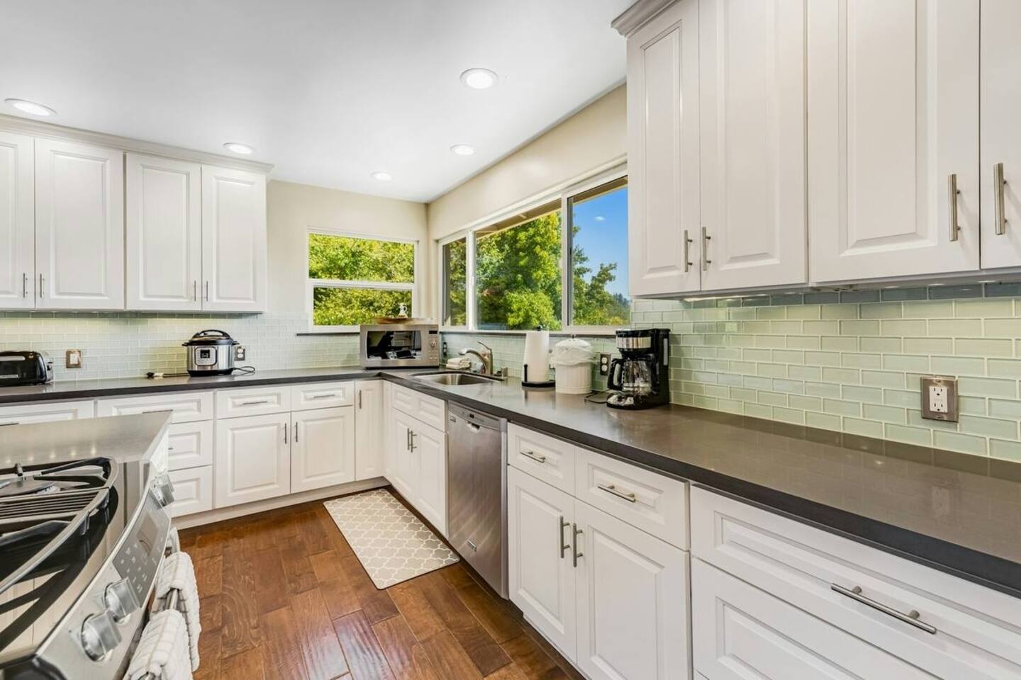 Cook with a view—sunlight pours in as you prep and gather.
