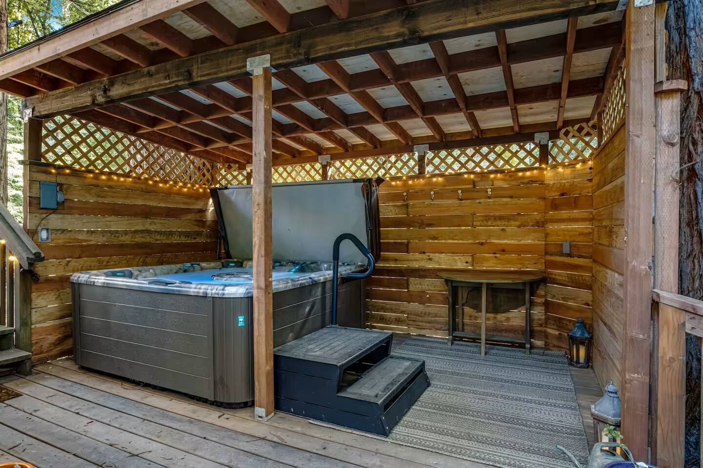 Soak in serenity with a private hot tub, offering total privacy.