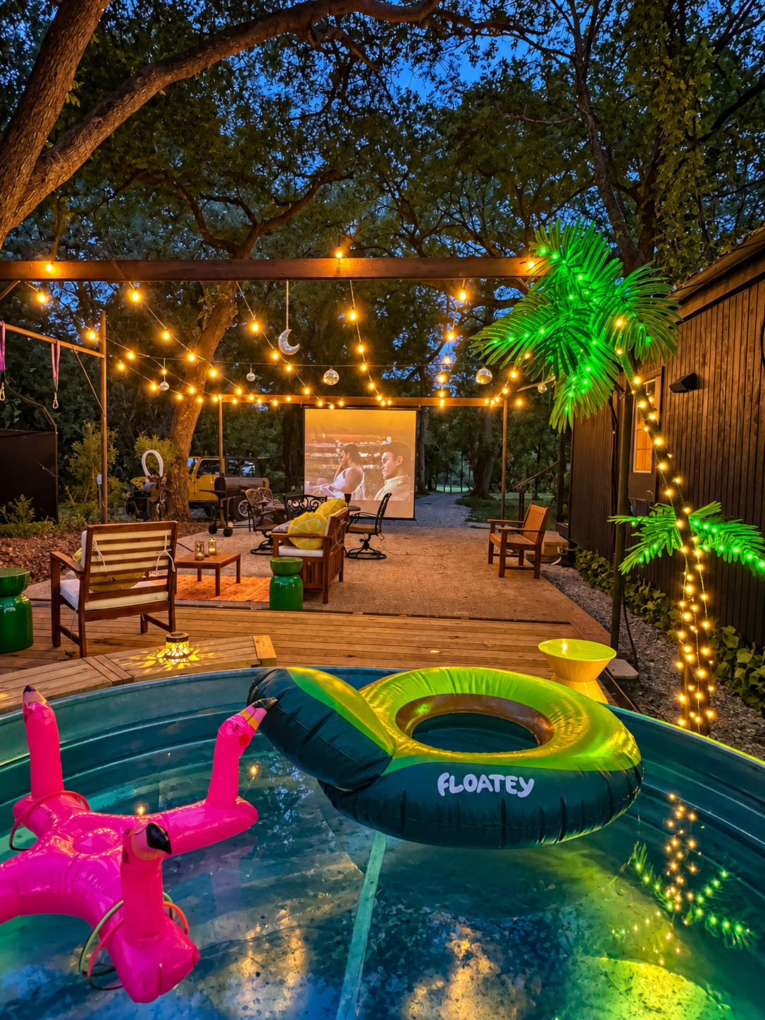 Twinkling lights, plunge pool, and outdoor movies under the trees