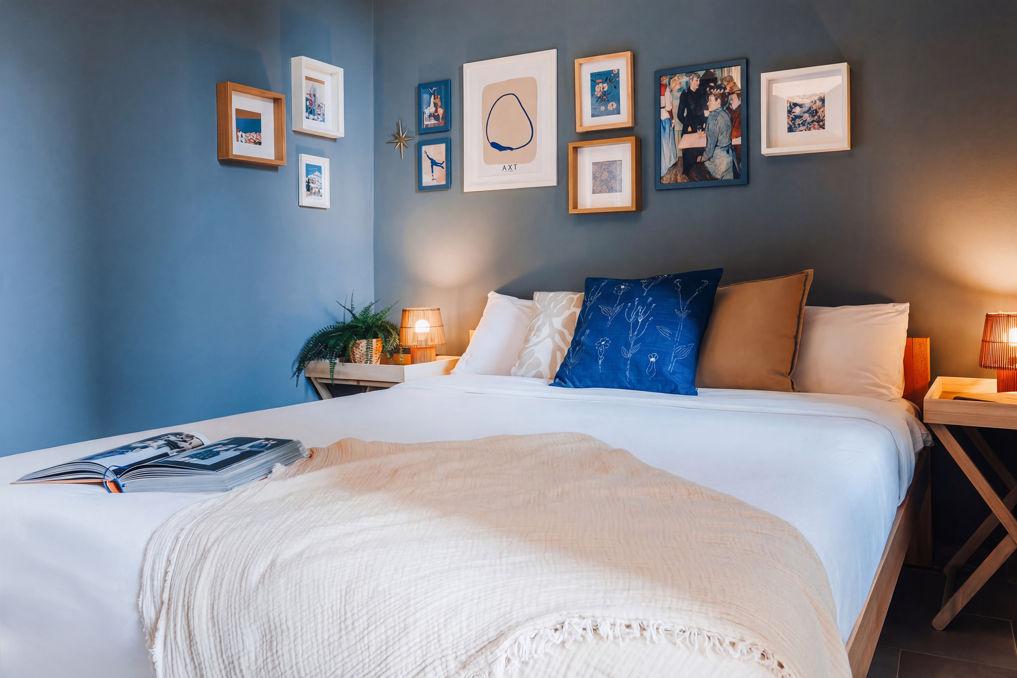 Cozy designer bedroom with warm lighting and stylish blue accent walls