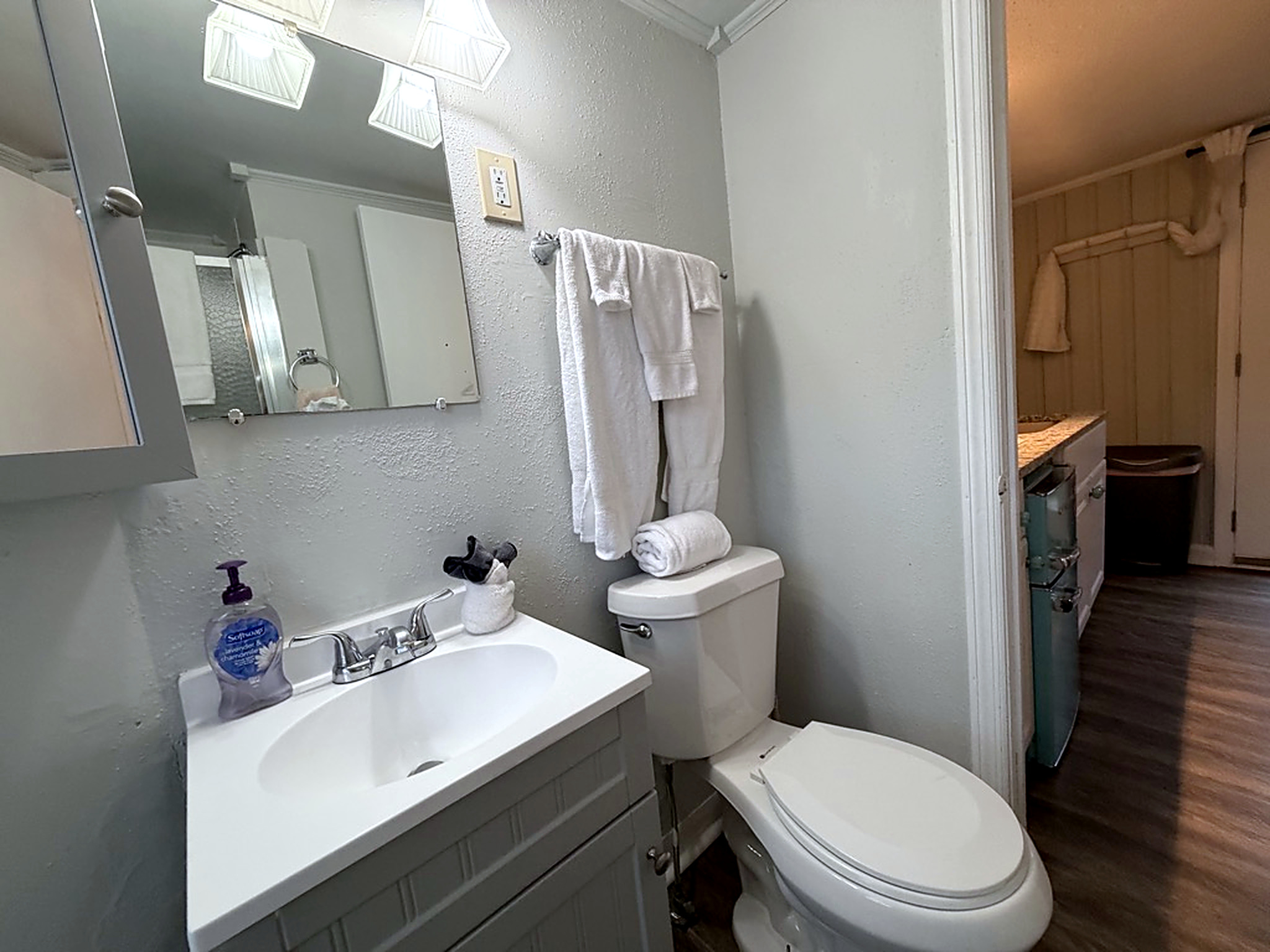 Bright, refreshed bathroom with modern vanity and fresh towels