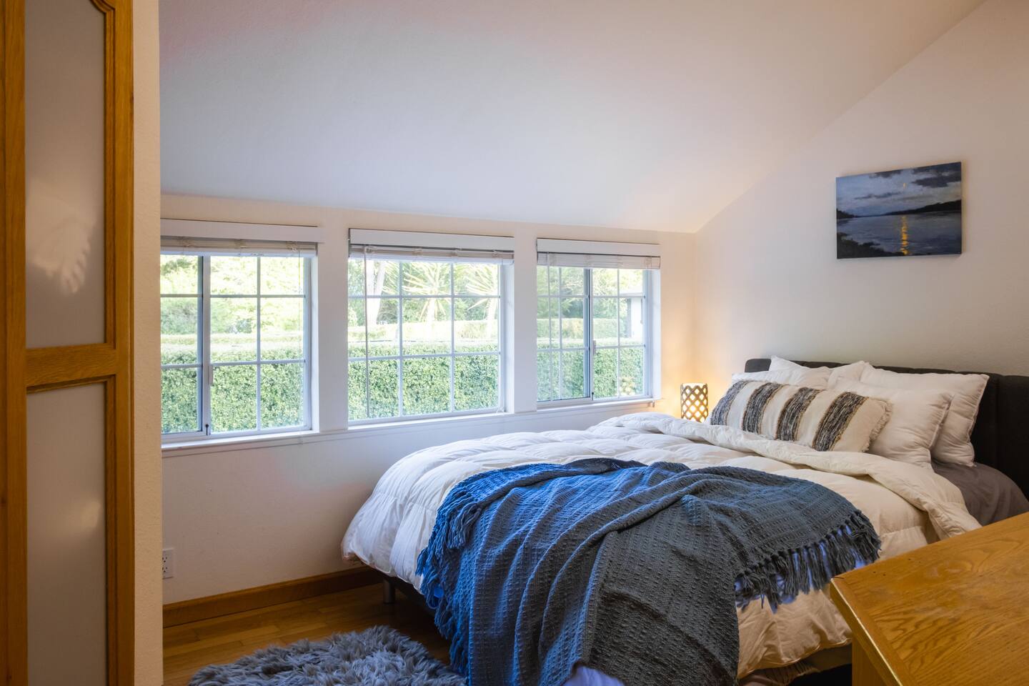 Relax in the cozy downstairs queen bedroom, complete with a TV for easy nights in.