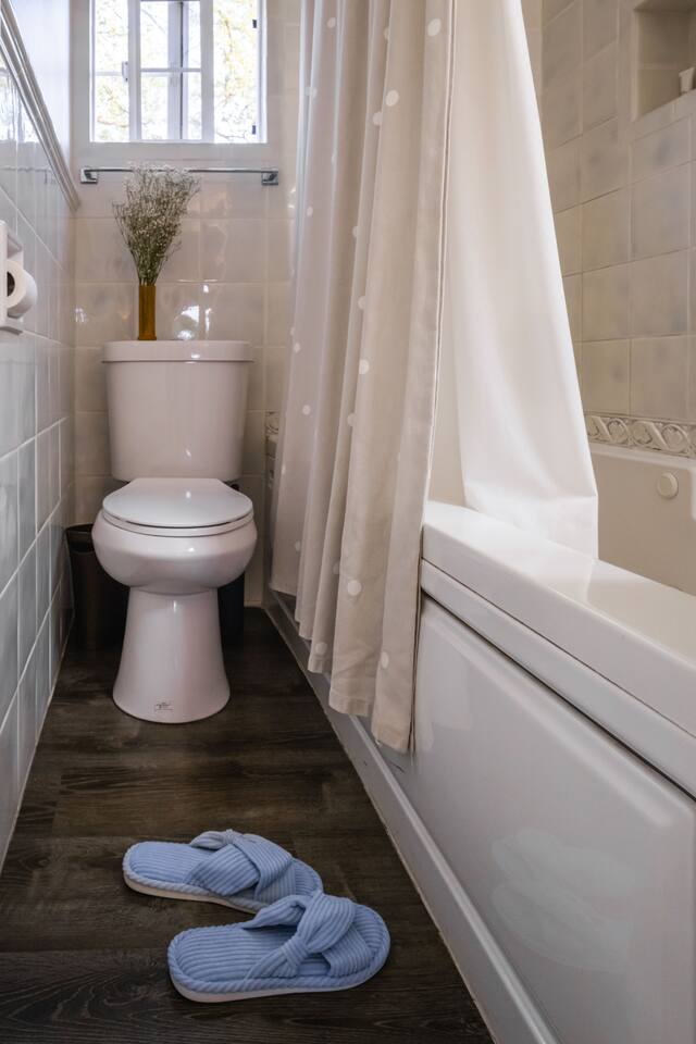 Comfort and style come together in this inviting full bathroom.