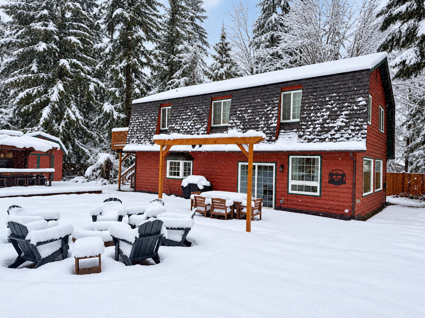 Cozy snowy cabin retreat with fire pit seating and forest views