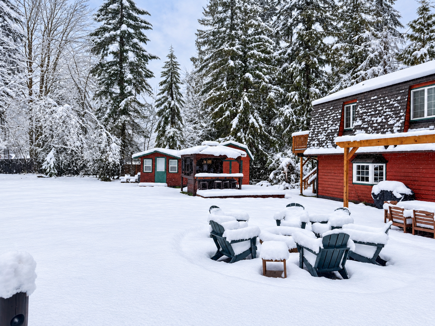 Cozy cabin retreat with snowy fire pit and serene forest surroundings