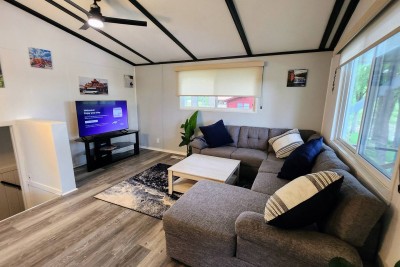 Main living room with sectional and TV