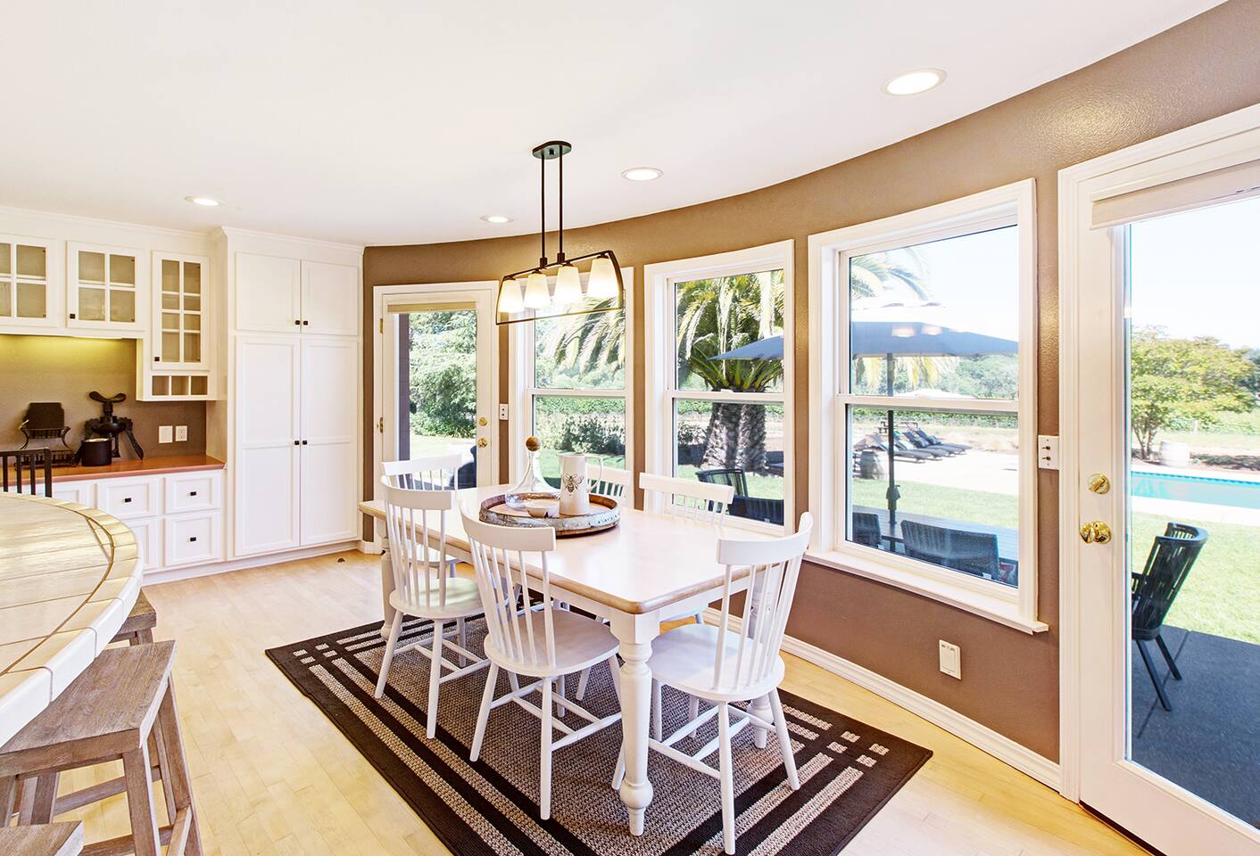The spacious kitchen opens onto the patio and pool.