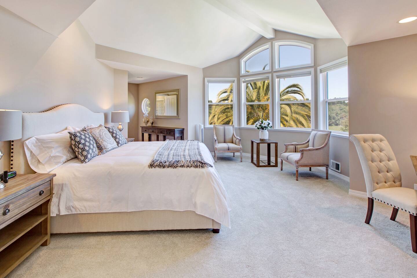 Master bedroom upstairs, with king bed. Each bedroom has an en-suite bathroom, deliciously comfortable Hughes pillowtop mattress, Hotel Collection linens, and hypoallergenic down-alternative pillows and comforters.