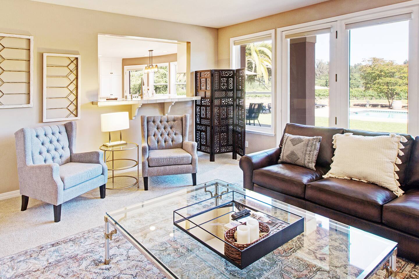 A peekaboo cutout between the kitchen and den allows TV viewing and chatting between the rooms.