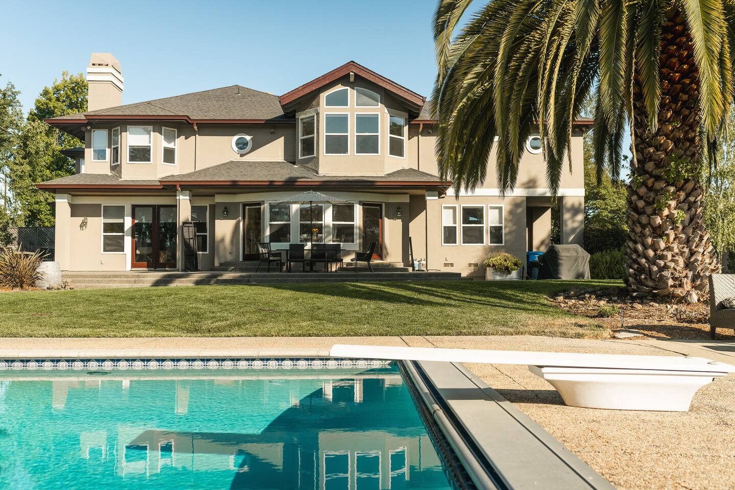 Dive in, dry off in the sun, then gather for lunch under the shade—this backyard was built for splashing, lounging, and together time.