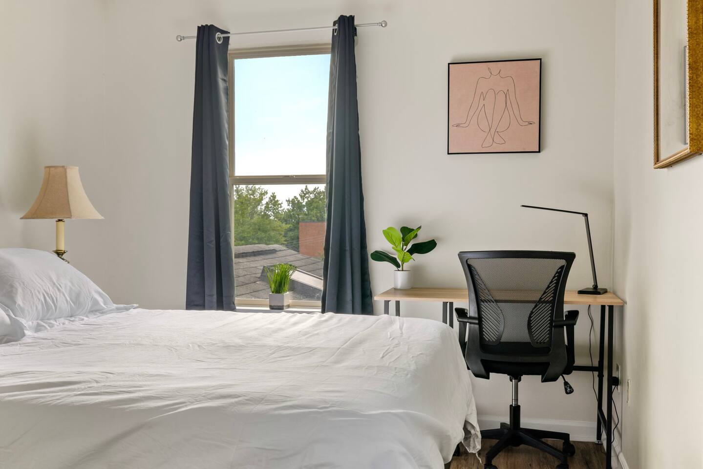 Sleek Room w/ Dedicated Workspace in Modern Home