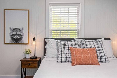 The lower level master hosts a queen bed and luxurious linens.