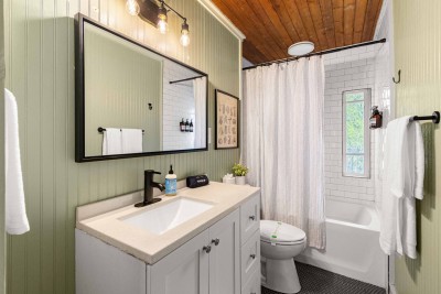 This is the main level guest bath.  There's a full size bathtub behind that curtain...just in case you want to