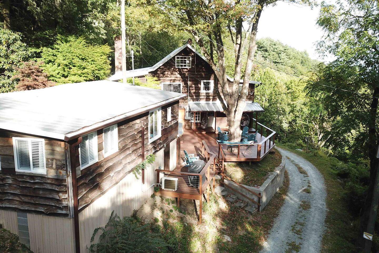 The shared 700 sq ft deck at The Orchard — Tiny Cabin on the left, Grand Cabin behind