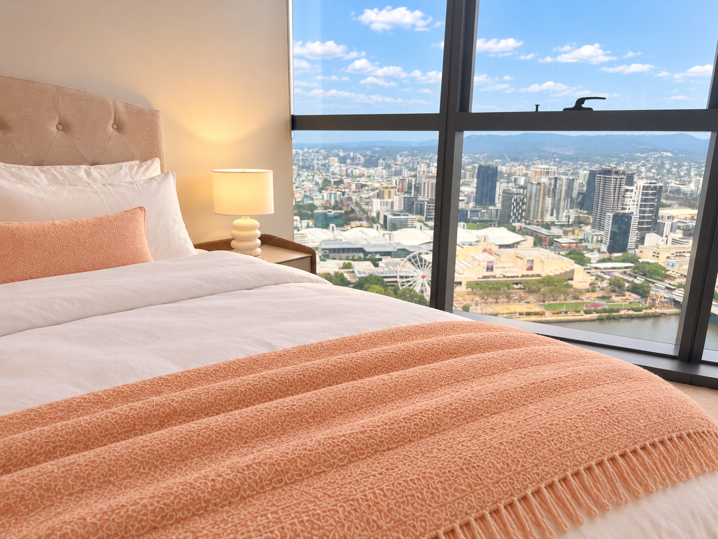 Wake up to stunning skyline views from this cozy, modern bedroom