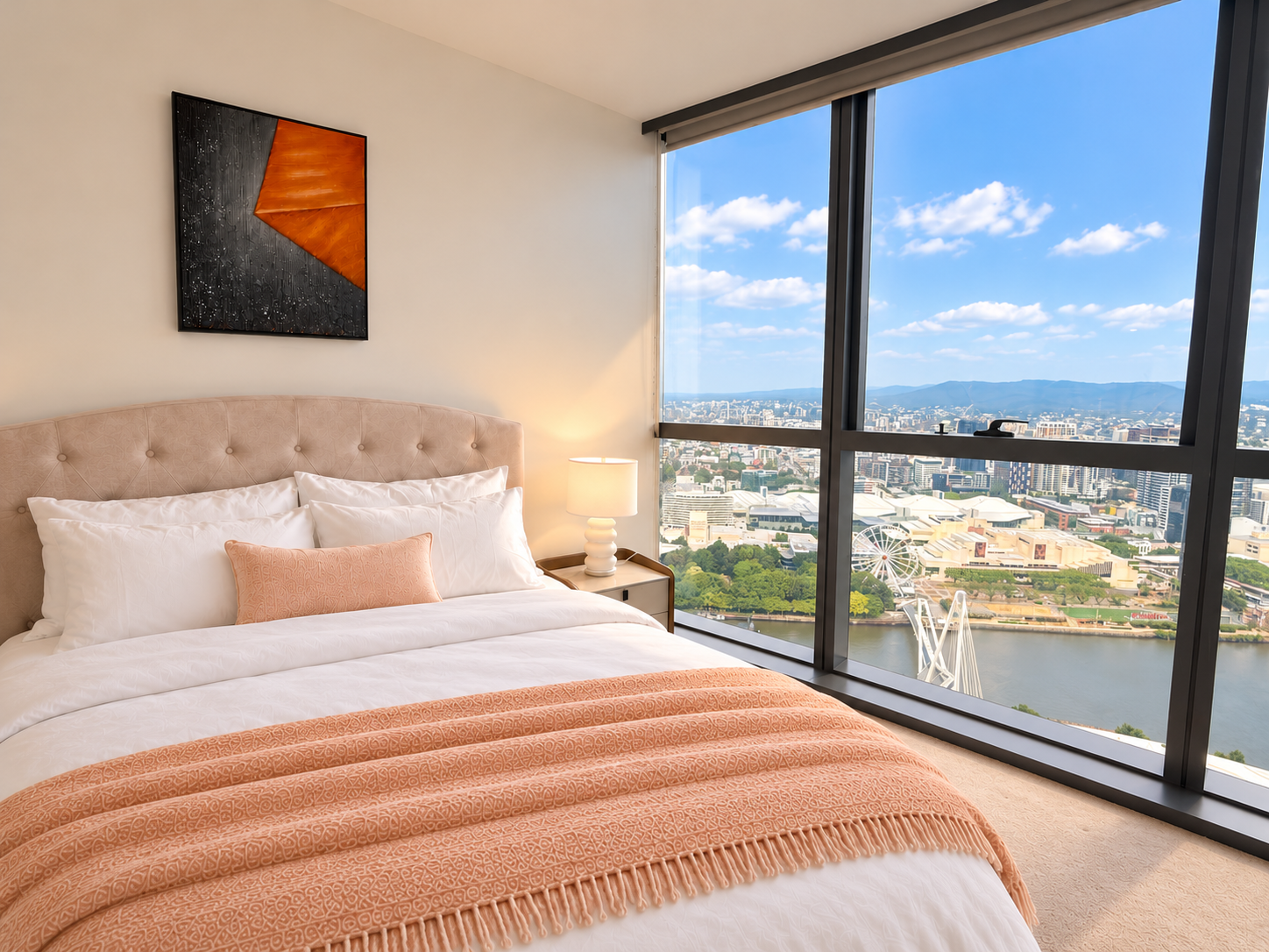 Wake up to sweeping city and river views from this serene modern bedroom