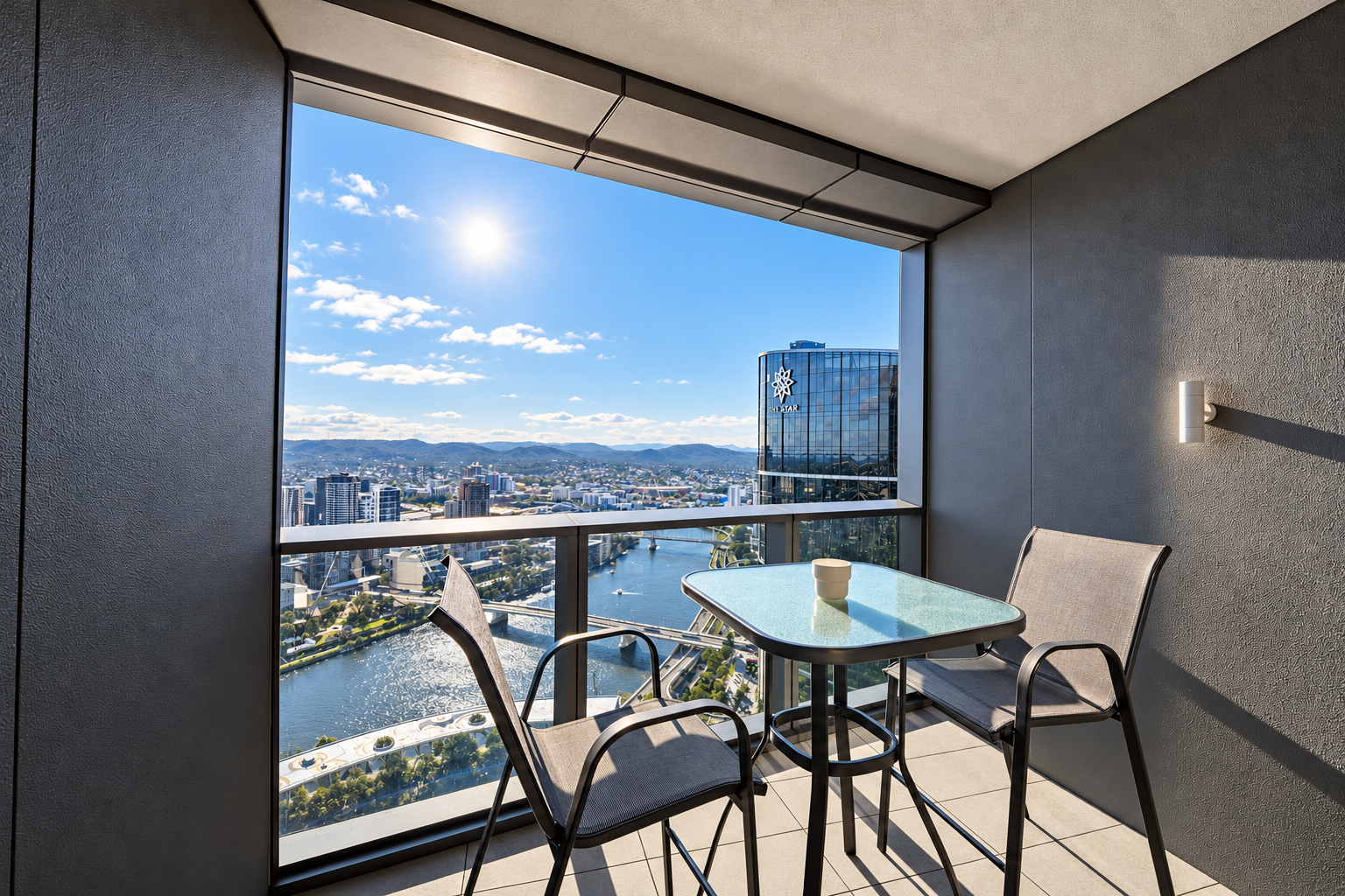 Private balcony with bistro seating and stunning city and river views