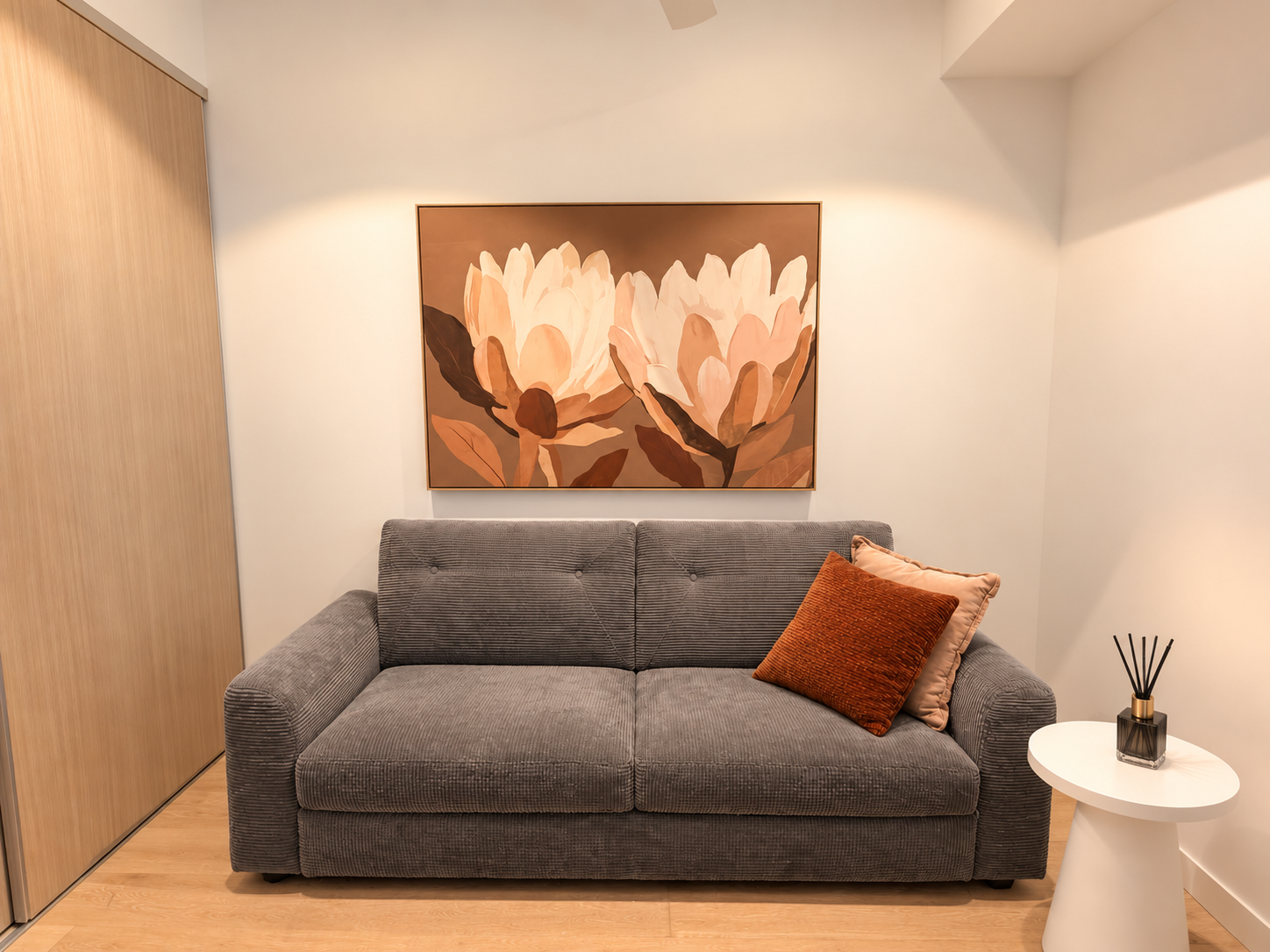 Cozy modern loveseat nook with warm décor and inviting touches
