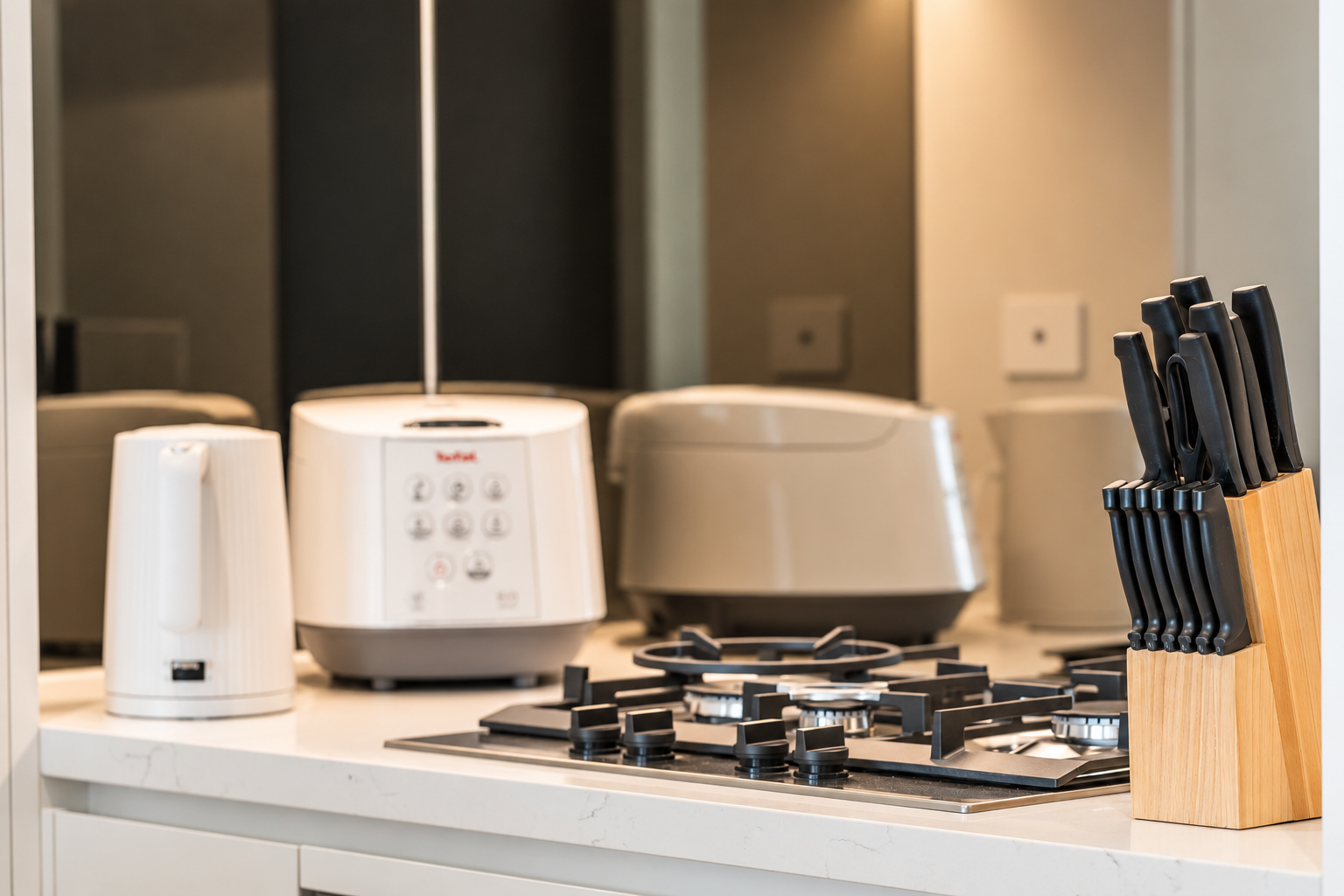 Modern kitchen with gas cooktop and handy countertop appliances