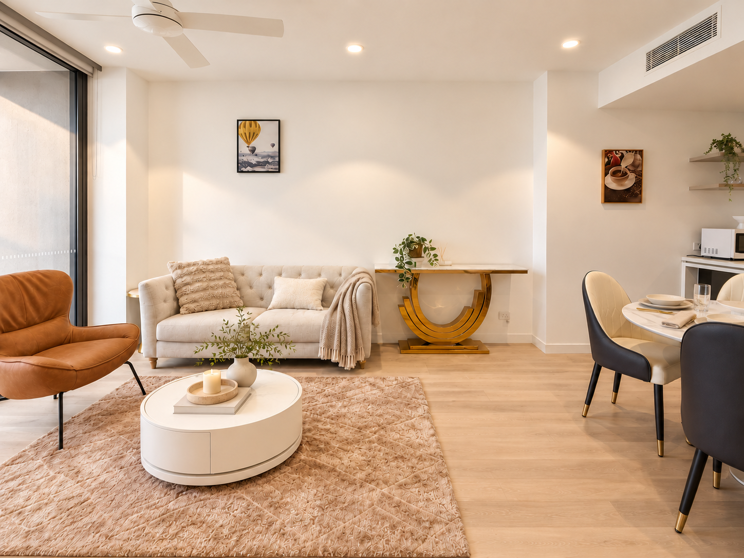 Bright modern lounge with cozy seating and elegant dining space