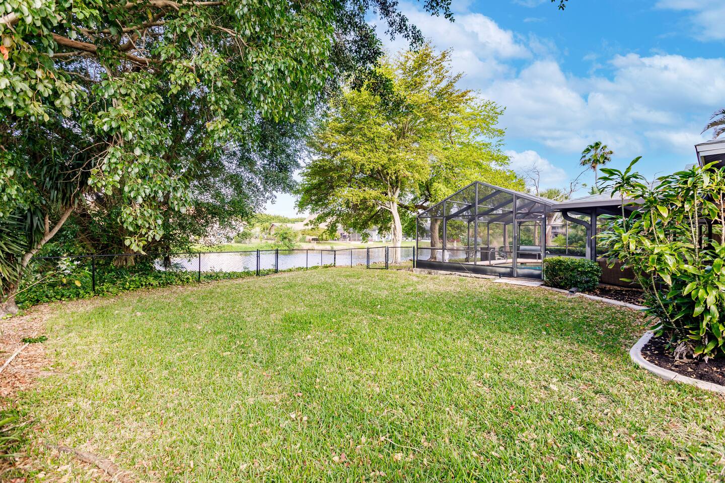 Large, private fenced backyard with lake views. Corn-hole and pool toys are free to use and located in the garage.