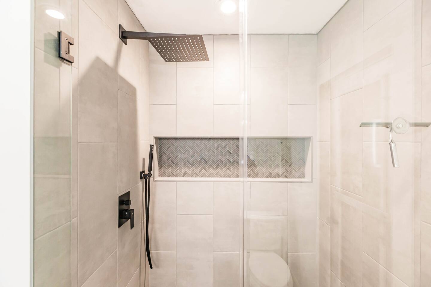Primary Bathroom rainfall shower and body wand.
