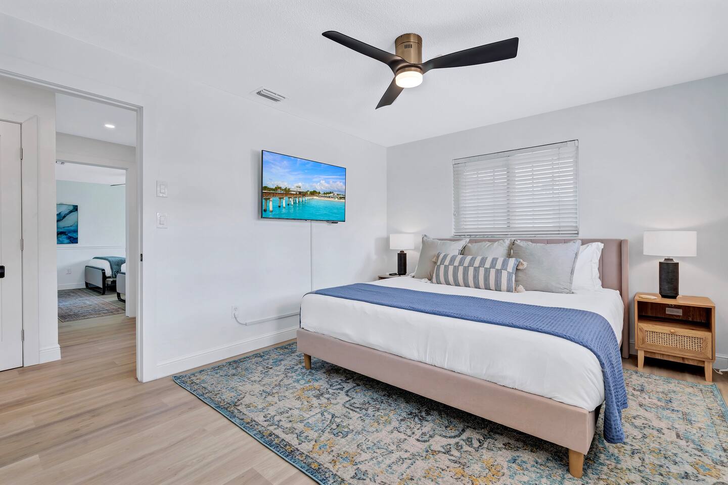 King Bedroom #2. Featuring a 55" TV, spacious closet and pool & garden view.