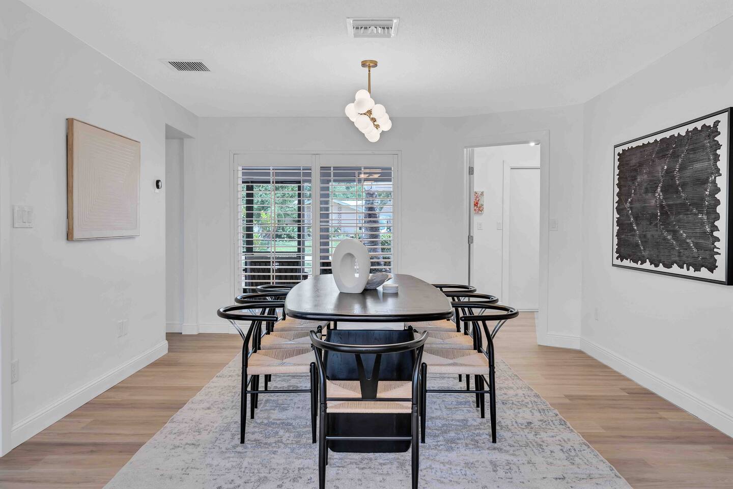 8-10 person dining table. If you wish to seat 10, grab the 2 chairs from the living room sitting area around the corner