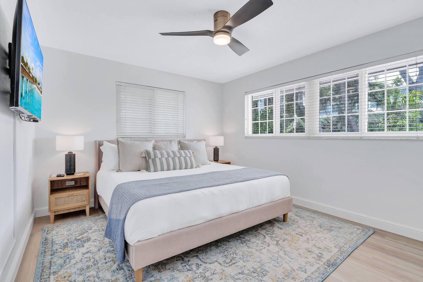 King Bedroom #2. Featuring a 55" TV, spacious closet and pool & garden view.