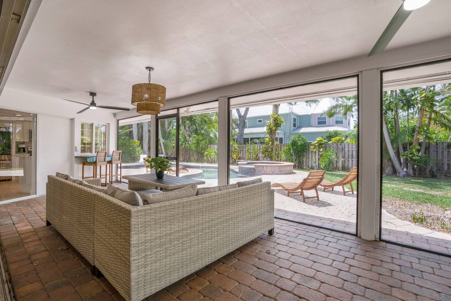 Dining area and bar counter under covered lanai.