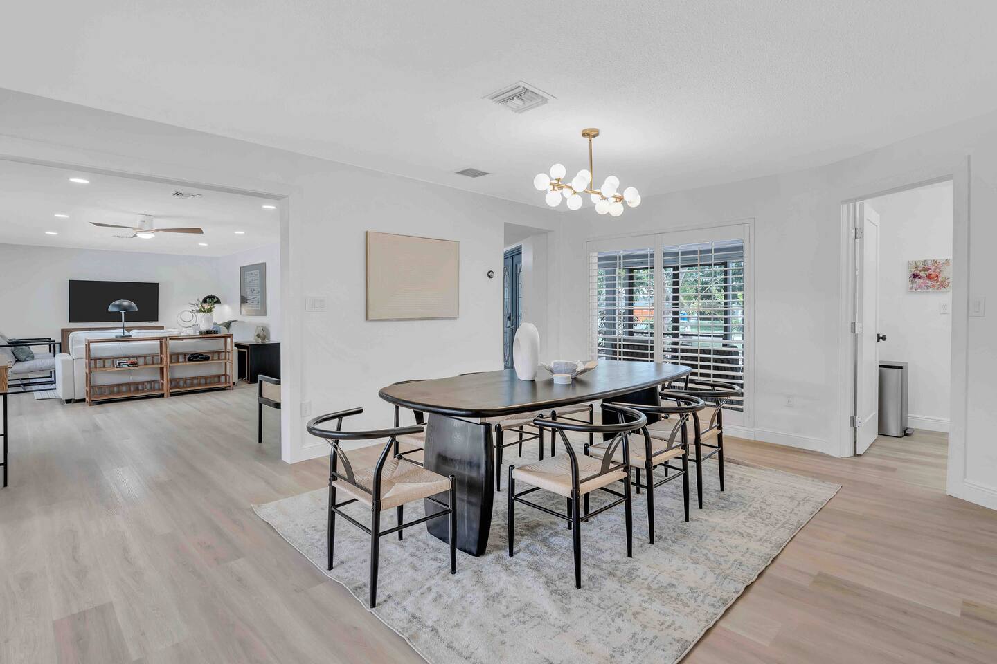 8-10 person dining table. If you wish to seat 10, grab the 2 chairs from the living room sitting area around the corner