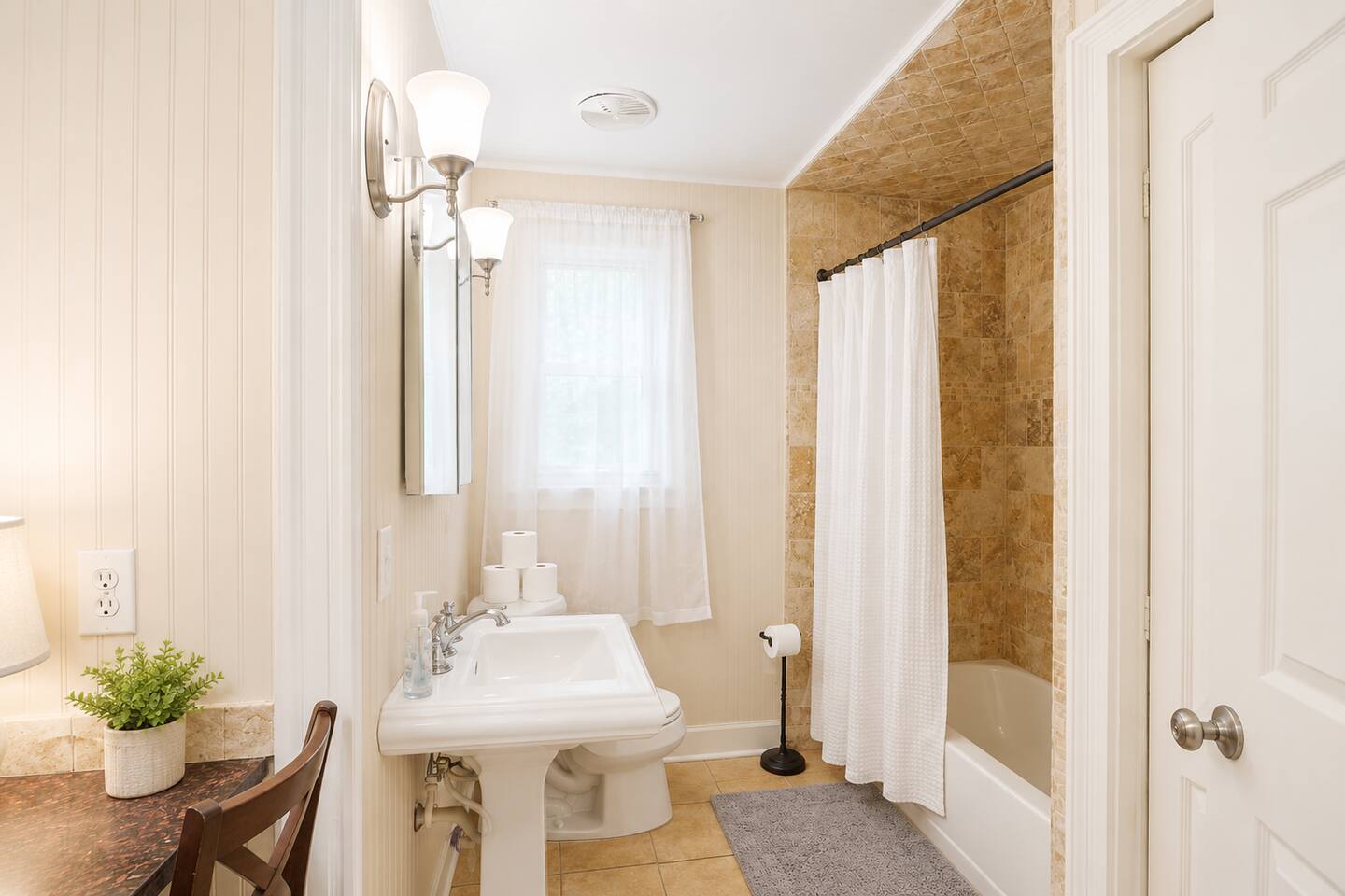 Bright, modern bathroom — unwind after a day on the St. Simons Island shoreline.