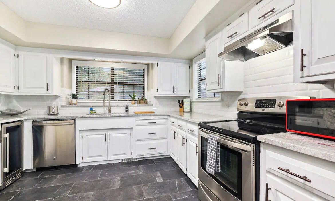 Through the dining room, you'll see a hallway that leads directly to our large, fully-stocked kitchen.