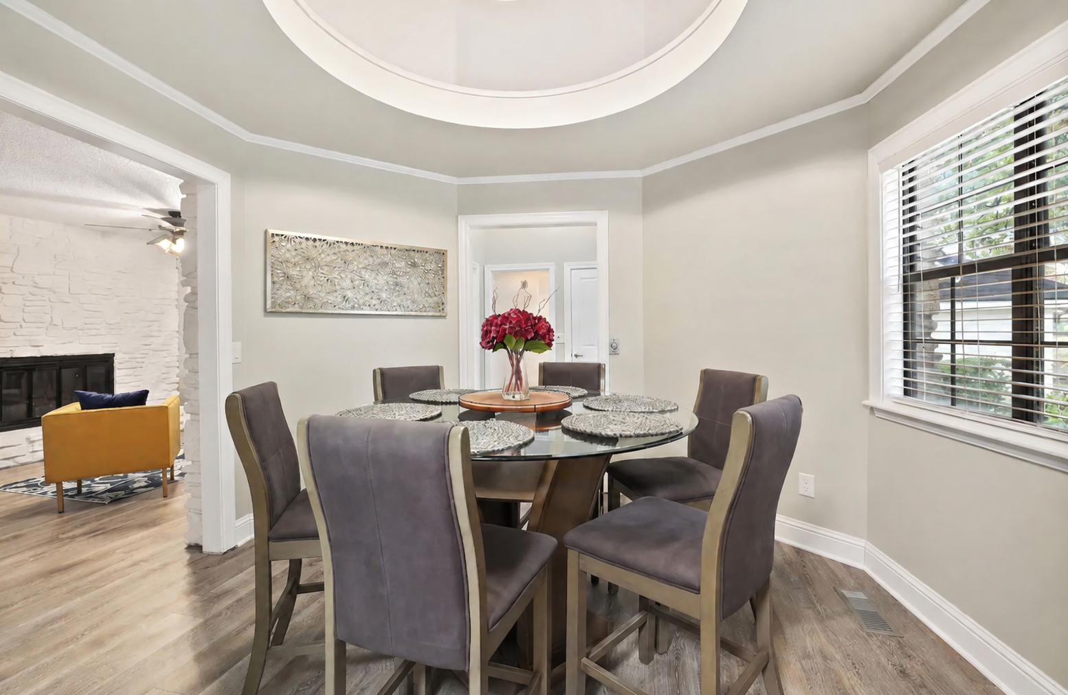 Off the living room, you'll find our dining room. Our round top table can seat up to six people.