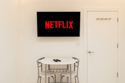 Relax with Netflix on a Smart TV in this cozy, modern dining nook for two.