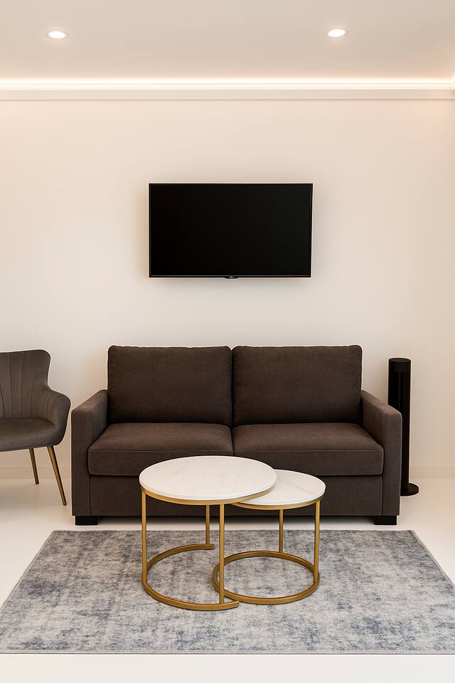 Modern lounge with sleek decor, smart lighting, and cozy seating.