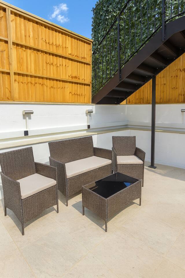 Stylish patio with cozy seating, perfect for relaxing or entertaining.