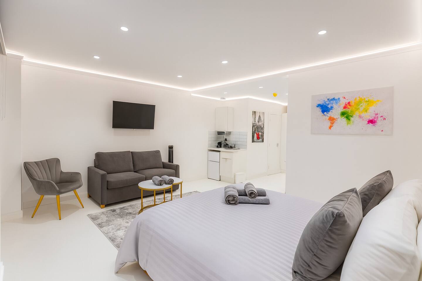 Bright modern studio with comfy bed, sofa lounge, mini kitchen and smart TV.
