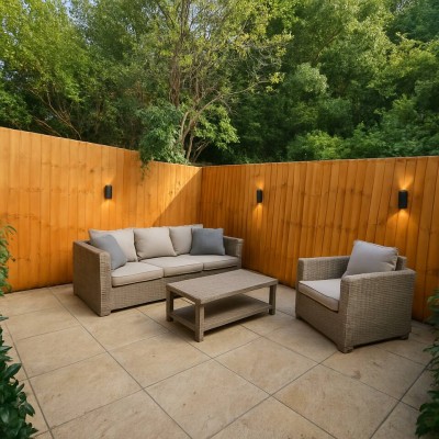 Relax in this private outdoor patio with stylish wicker seating and ambient lights.