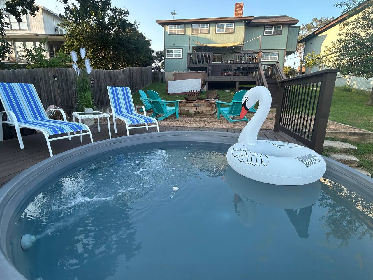 Newly added deck and stock tank pool to cool off on a hot day