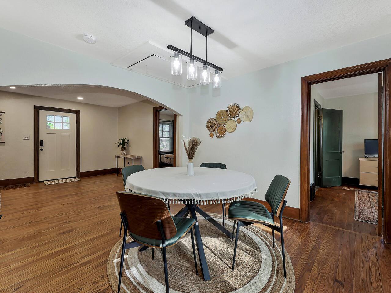Our dining space seats 4, with comfortable chairs for enjoying meals or use as a workspace during extended stays!
