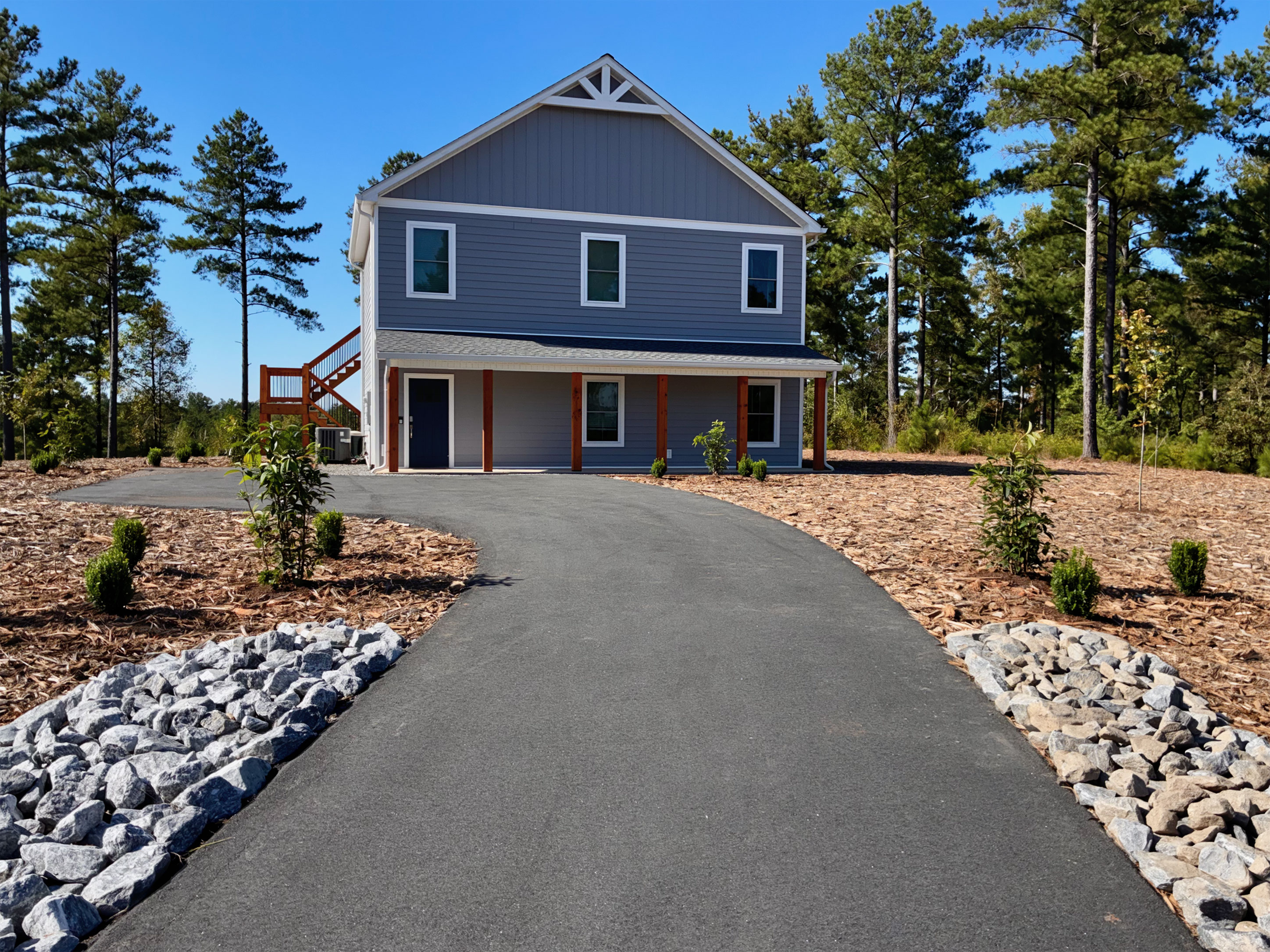 Modern woodland retreat with private drive and fresh curb appeal