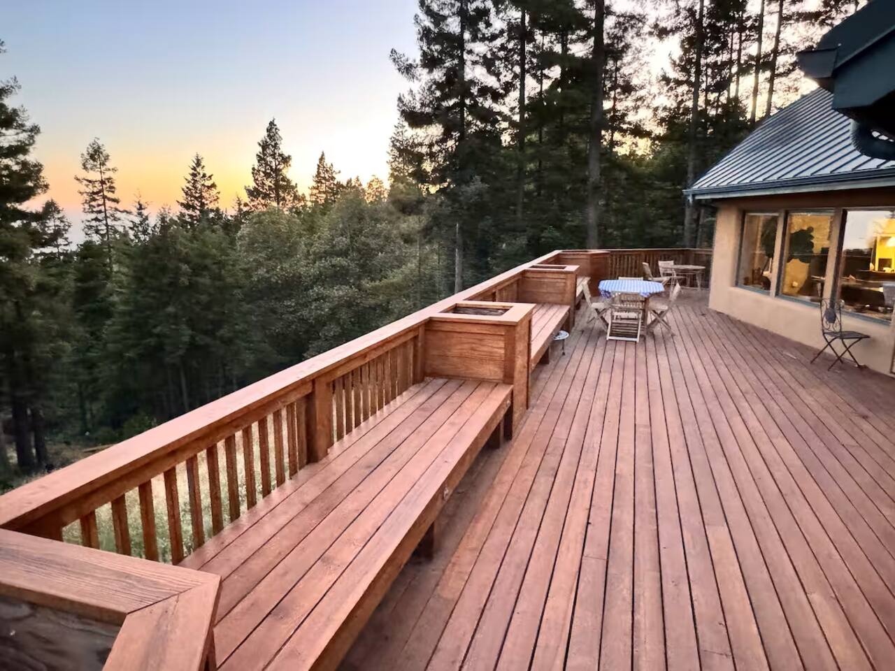 Spacious wraparound deck with endless forest views.