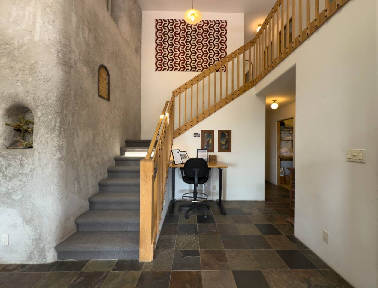 Bright entryway with vaulted ceilings welcoming you in.