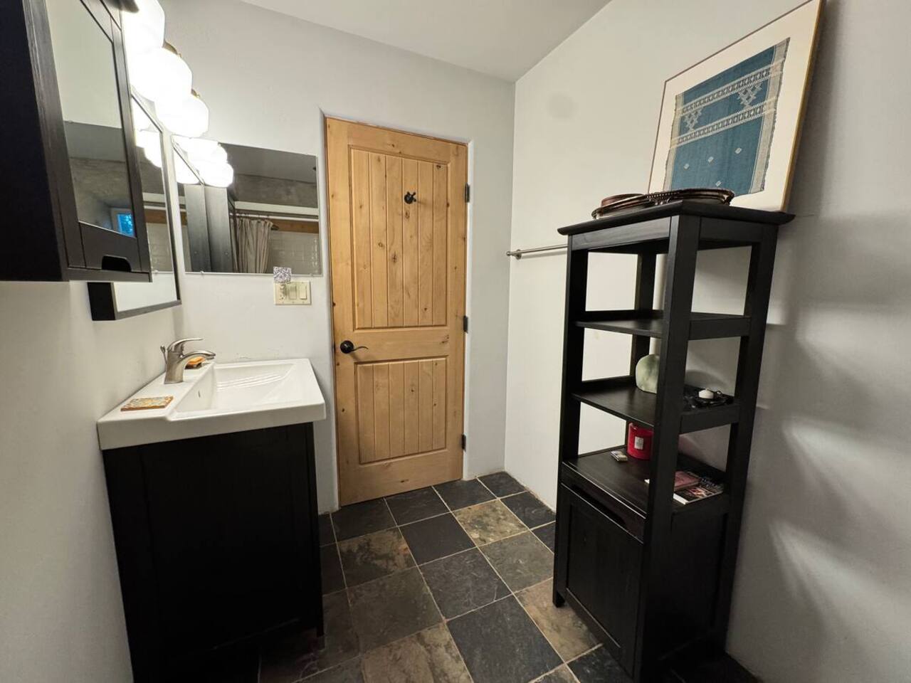 Modern bathroom with sleek finishes and natural stone tile.
