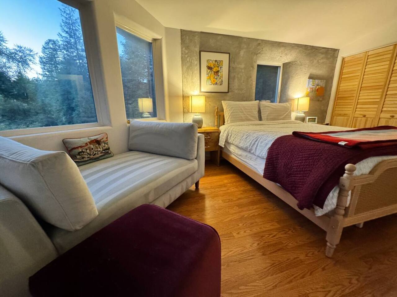 Queen room with seating area — perfect for quiet reading.