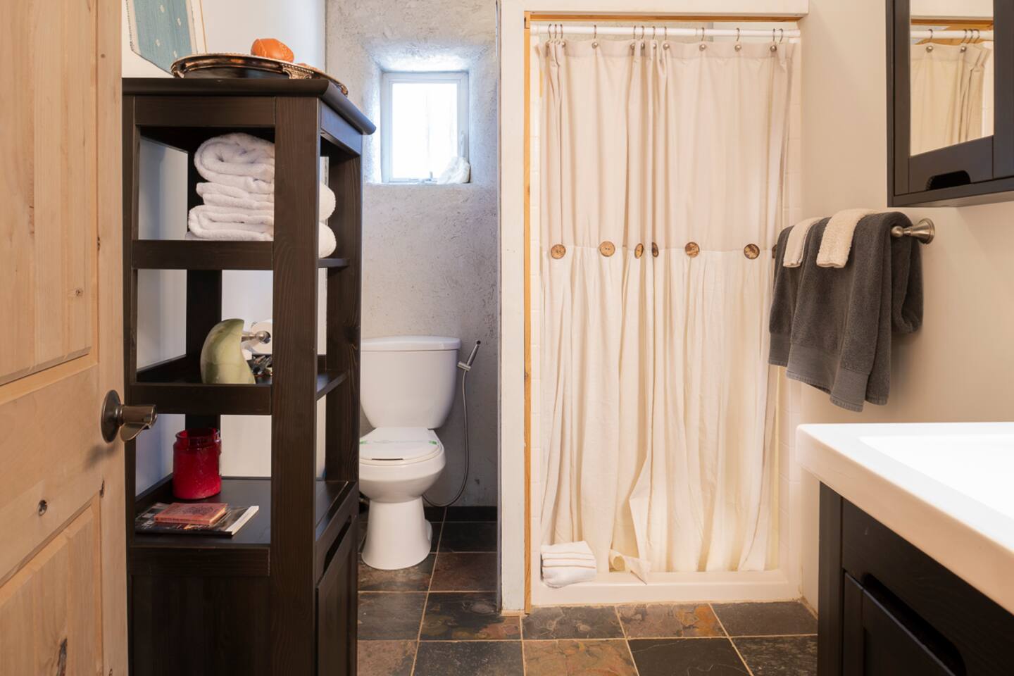 Freshly updated bathroom with ample storage space.